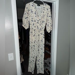 Vici size small white floral jumpsuit. No tags but never been worn